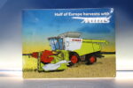 Cartel, chapa metálica y porcelana “Half of Europe harvest with Mitas. Claas”. 2015. Original.