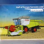 Cartel, chapa metálica y porcelana “Half of Europe harvest with Mitas. Claas”. 2015. Original.
