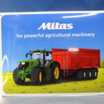 Cartel, chapa metálica y porcelana “Mitas for powerful agricultural machinery”. 2016. Original.